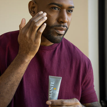 MANTL Invisible Daily SPF 30 1oz tube with co-founder Karamo Brown