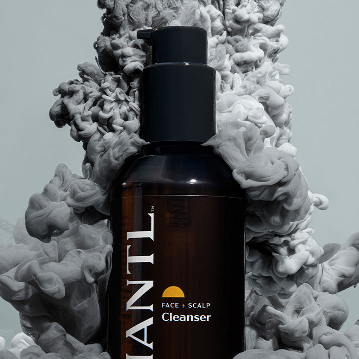 MANTL face + scalp cleanser in a cloud of smoke
