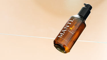 Mantl Cleanser on peach background